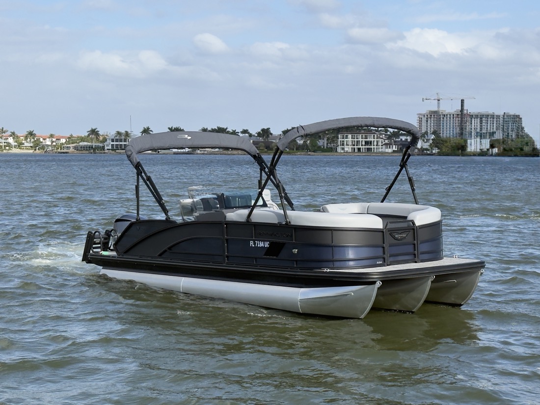 The Sand Dollar Boat Tours Bennington tritoon on the water near Naples, Florida