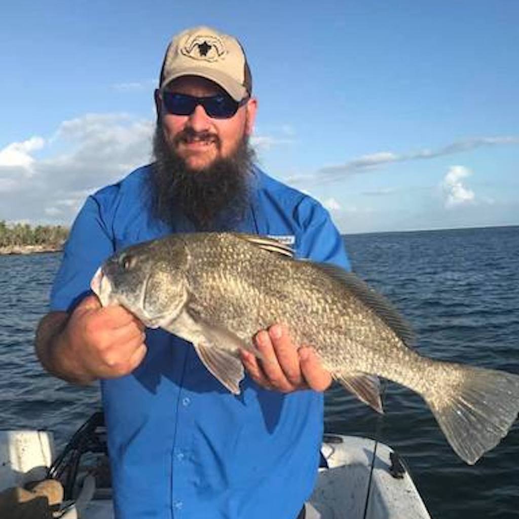 An angler fishing on a licensed Naples charter, Florida