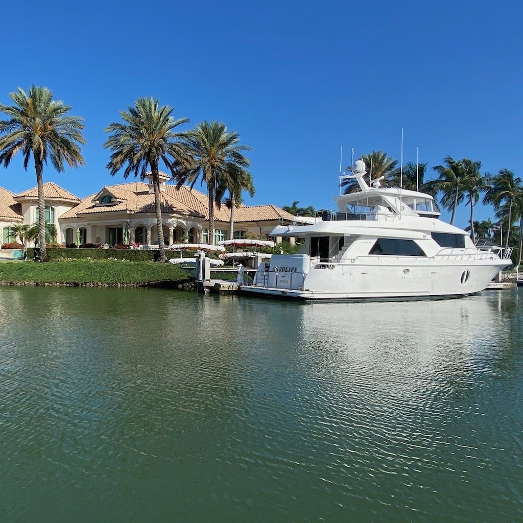 A Sand Dollar boat tour cruising the waterfront mansions of Port Royal in Naples, Florida