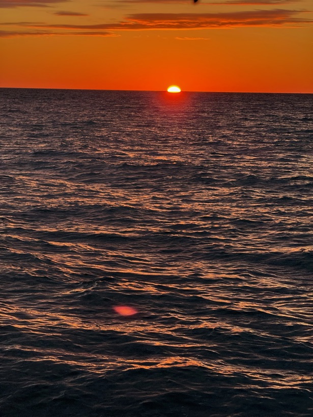 A brilliant fiery orange and red sunset over the Gulf of Mexico near Marco Island, Florida